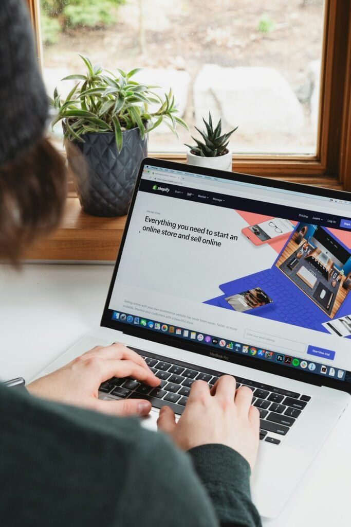 Working on a Shopify store on a laptop
